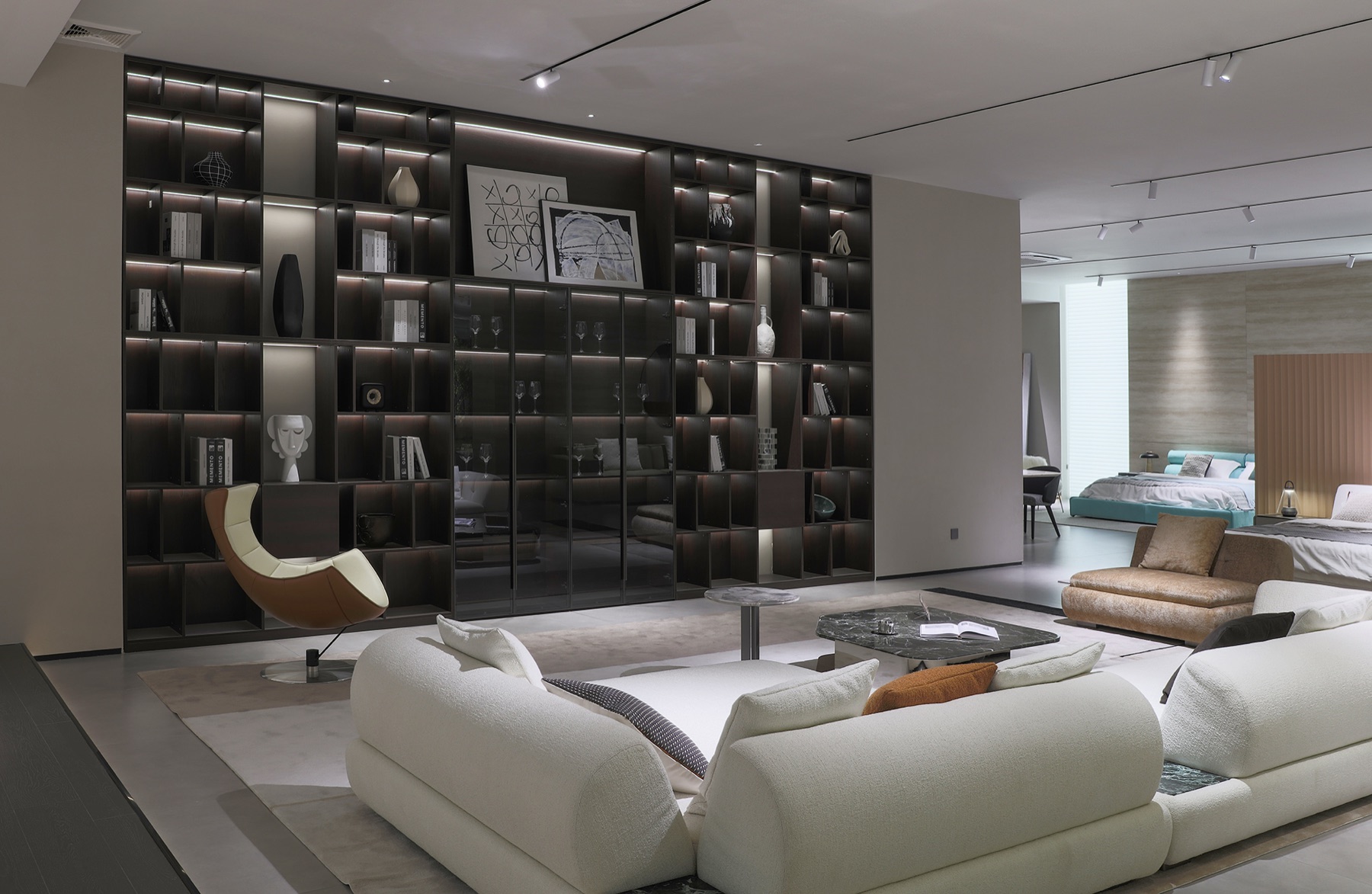 CXCASA Foshan showroom with high-end sofas, custom cabinetry, lighting, and soft decor